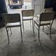 4 chrome metal chairs with faux leather from the 1970s.
