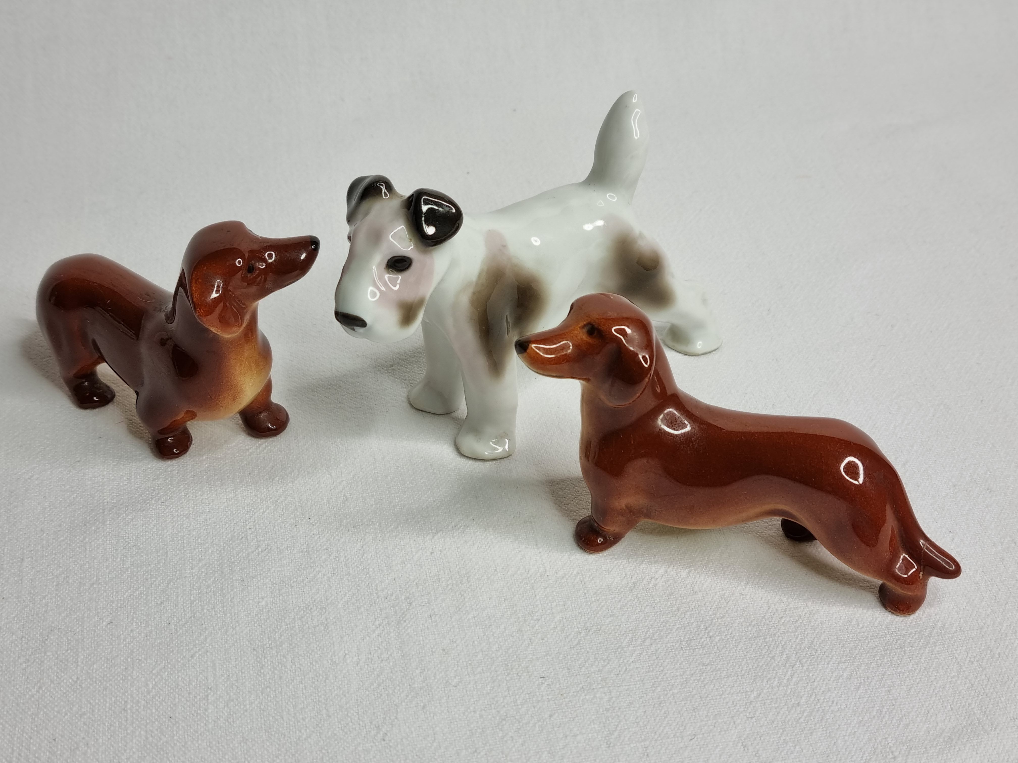 Set of three porcelain puppies