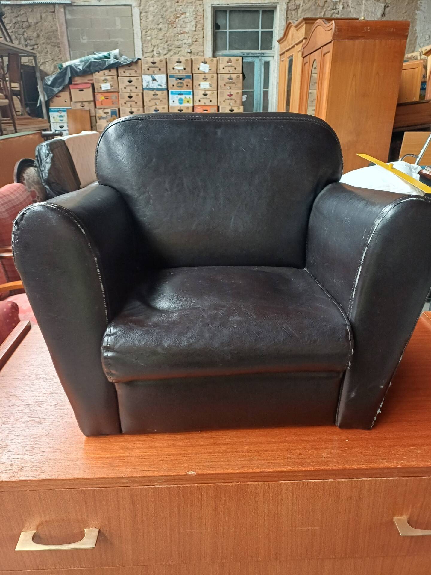 Mini black leather armchair for children