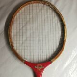 Red ribbon wooden badminton racket