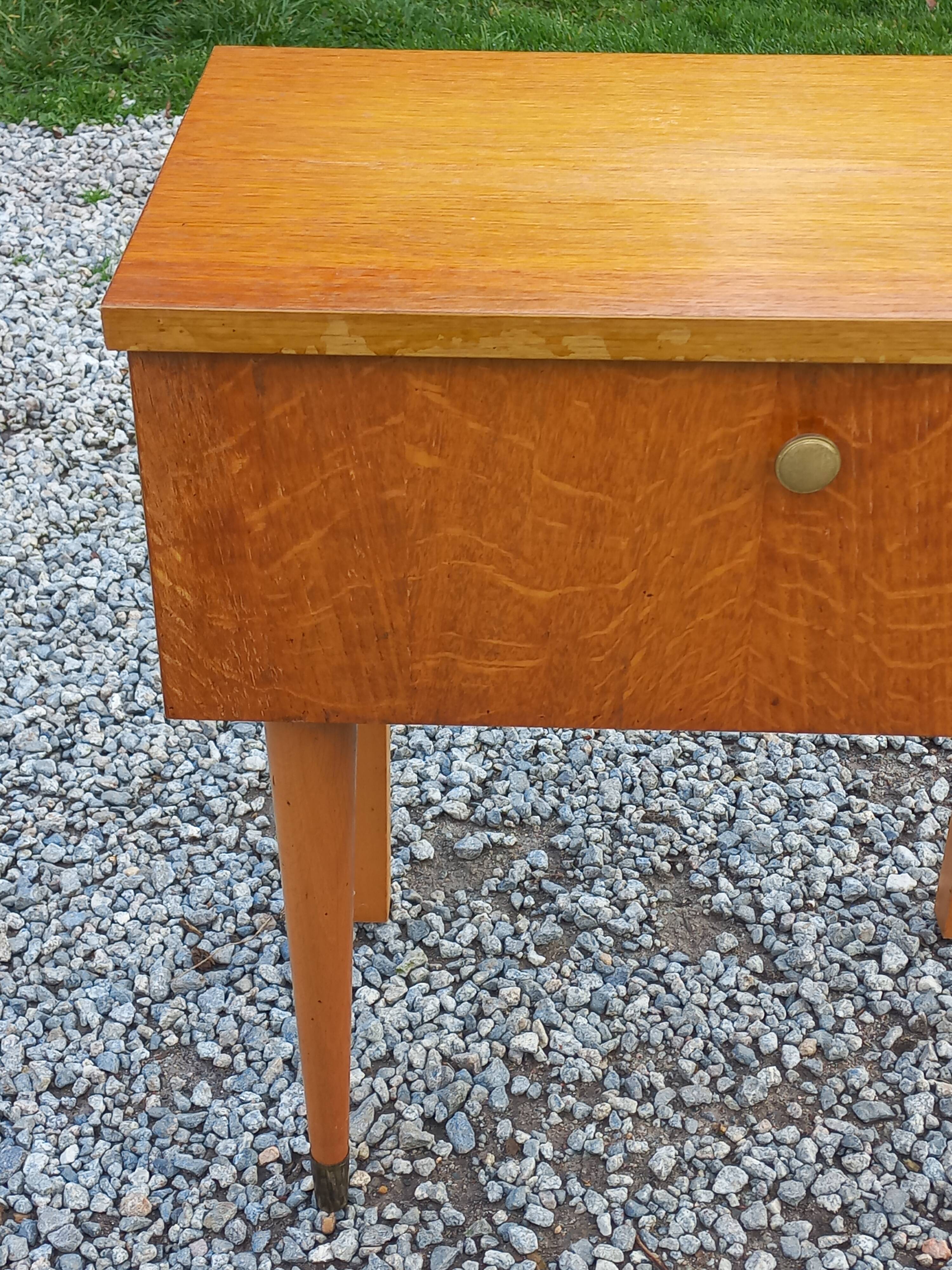 Vintage 1950s bedside table in blond oak with conical legs