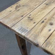 Early 20th-century farmhouse table made of fir, elm, and chestnut.