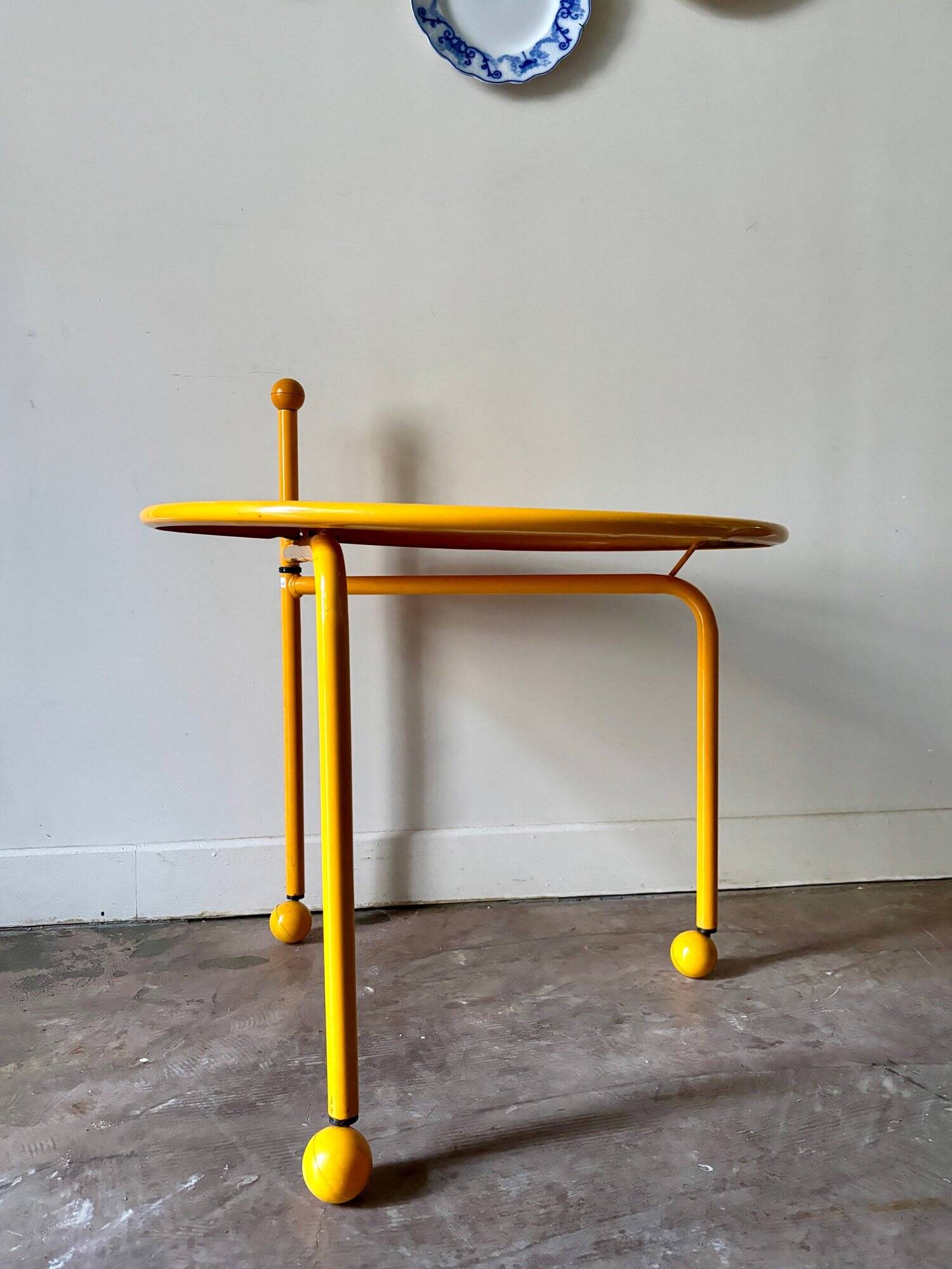 Yellow metal tripod coffee table by Tord Bjorklund for Ikea, circa 1980
