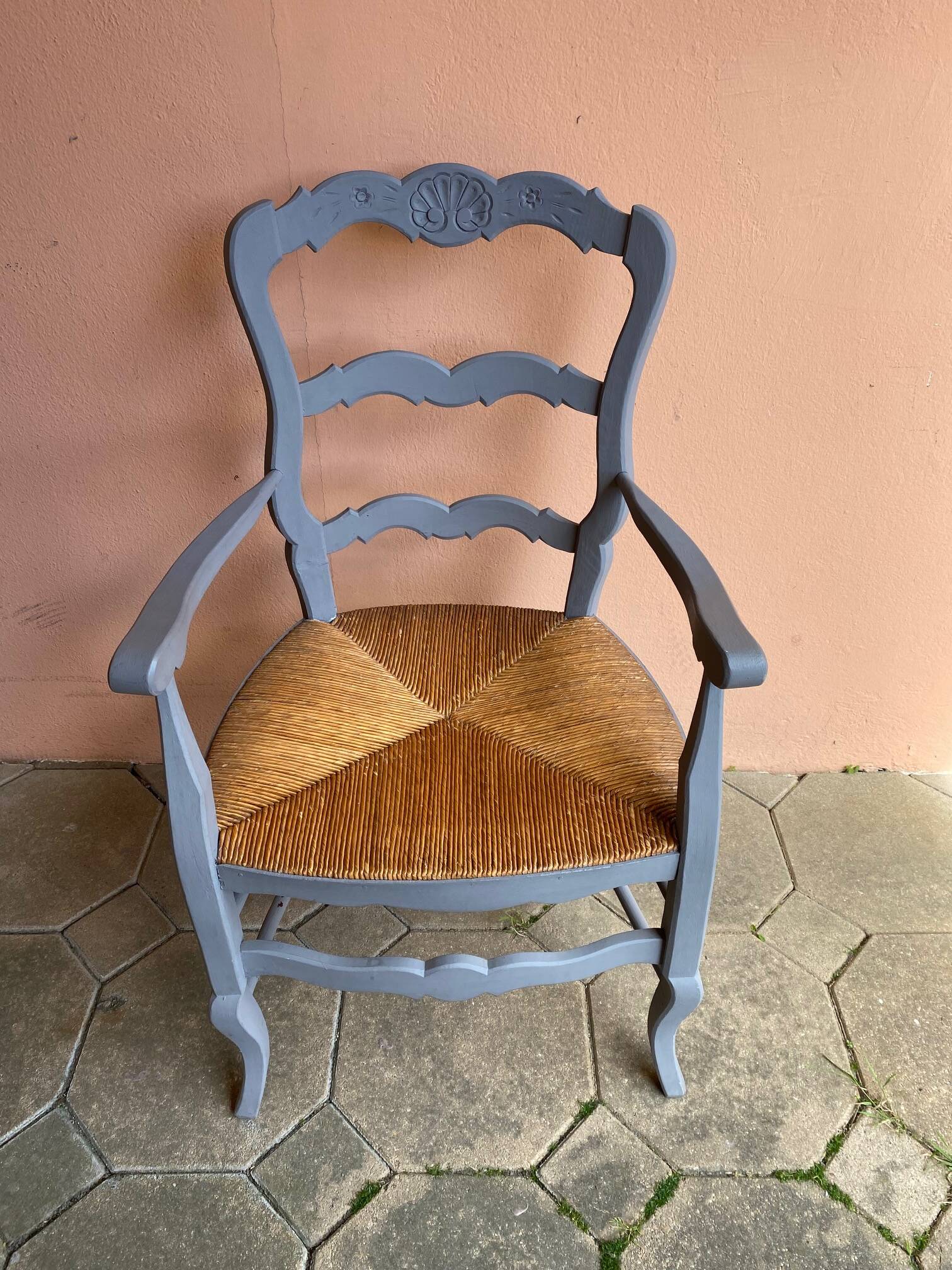 Provencal style straw armchair with gray blue patina armrests