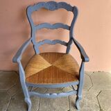 Provencal style straw armchair with gray blue patina armrests