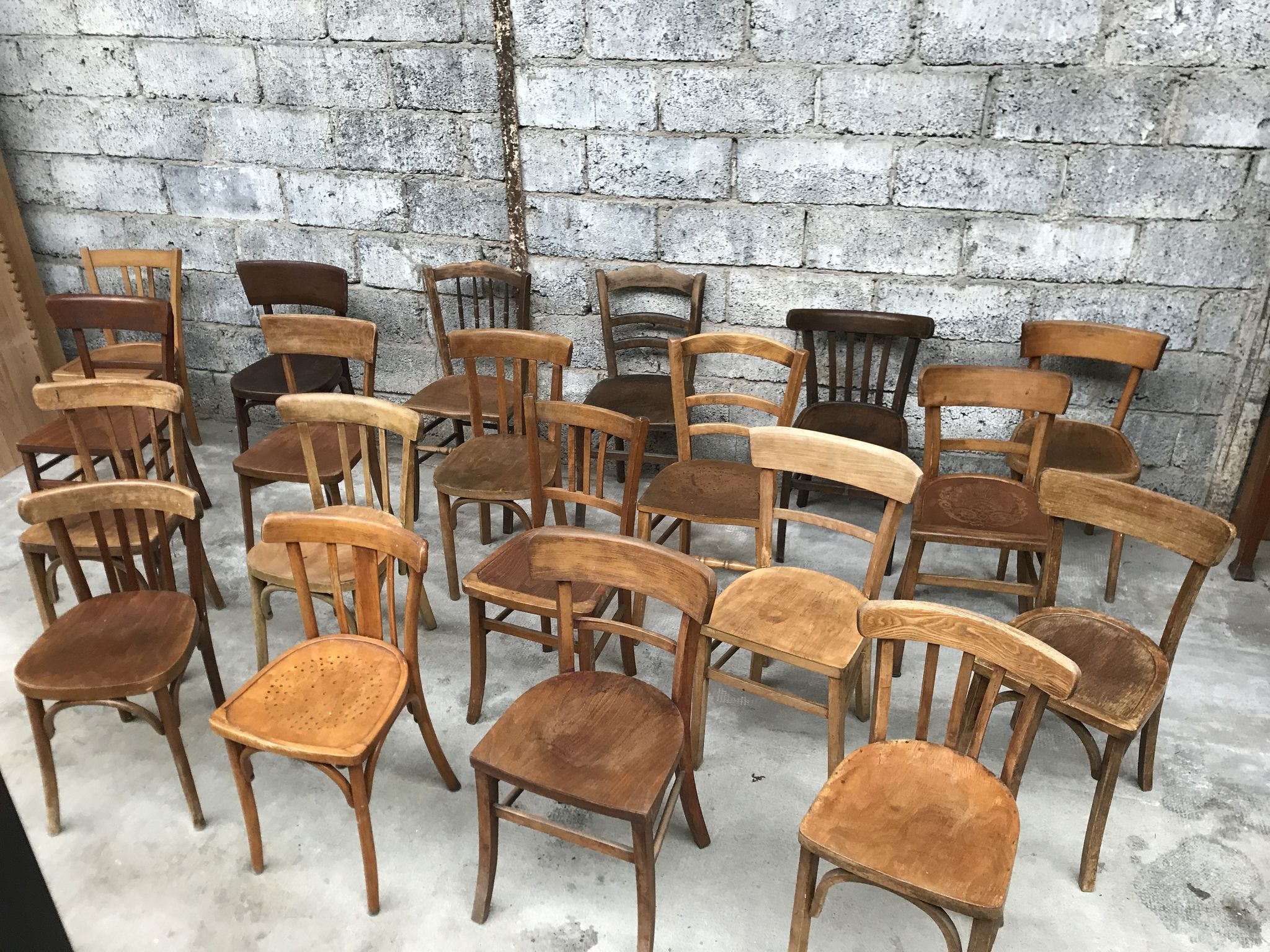 Set of 15 mismatched curved wood bistro chairs