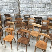 Set of 15 mismatched curved wood bistro chairs