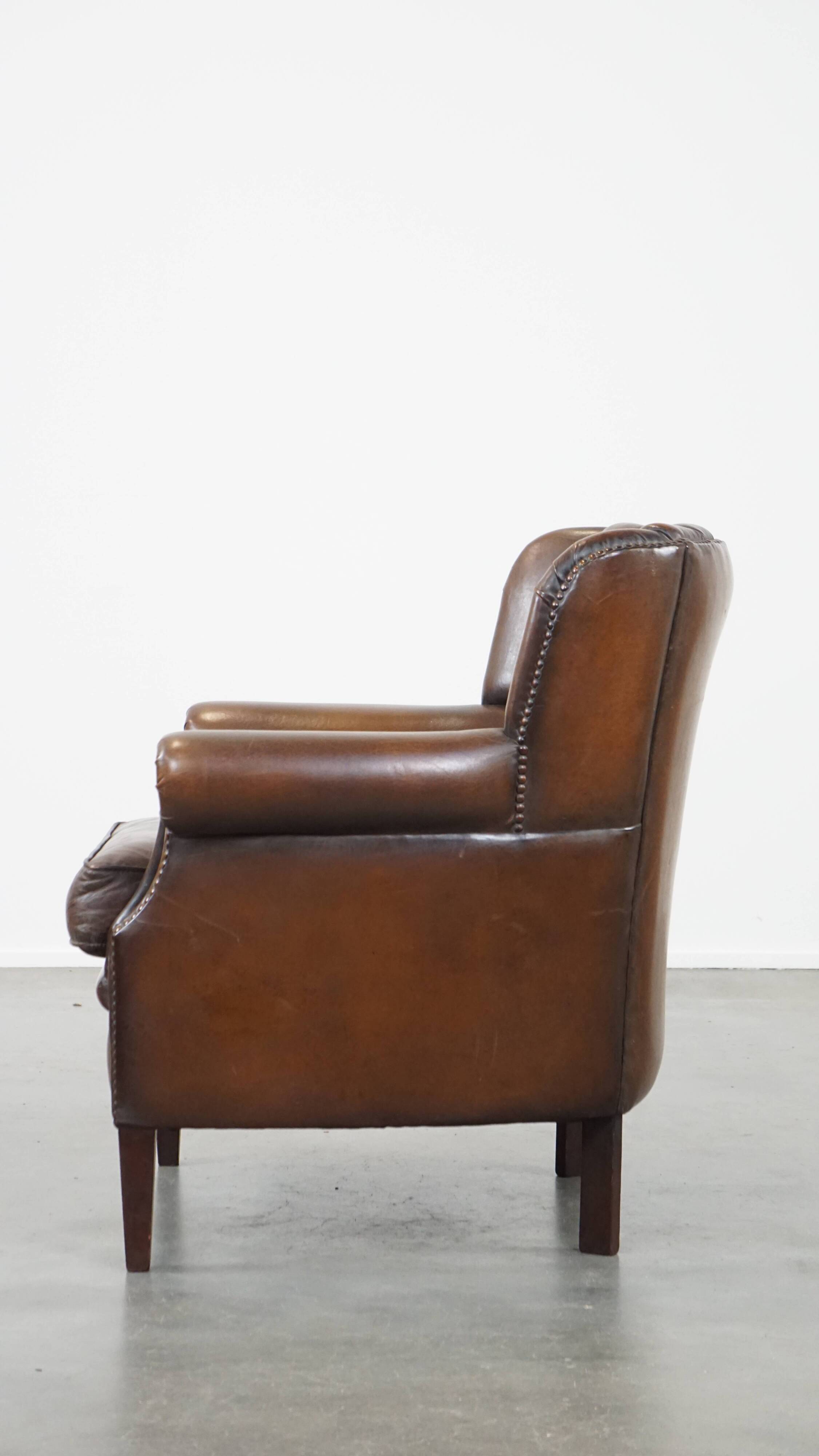 Sheep leather armchair finished with decorative nails