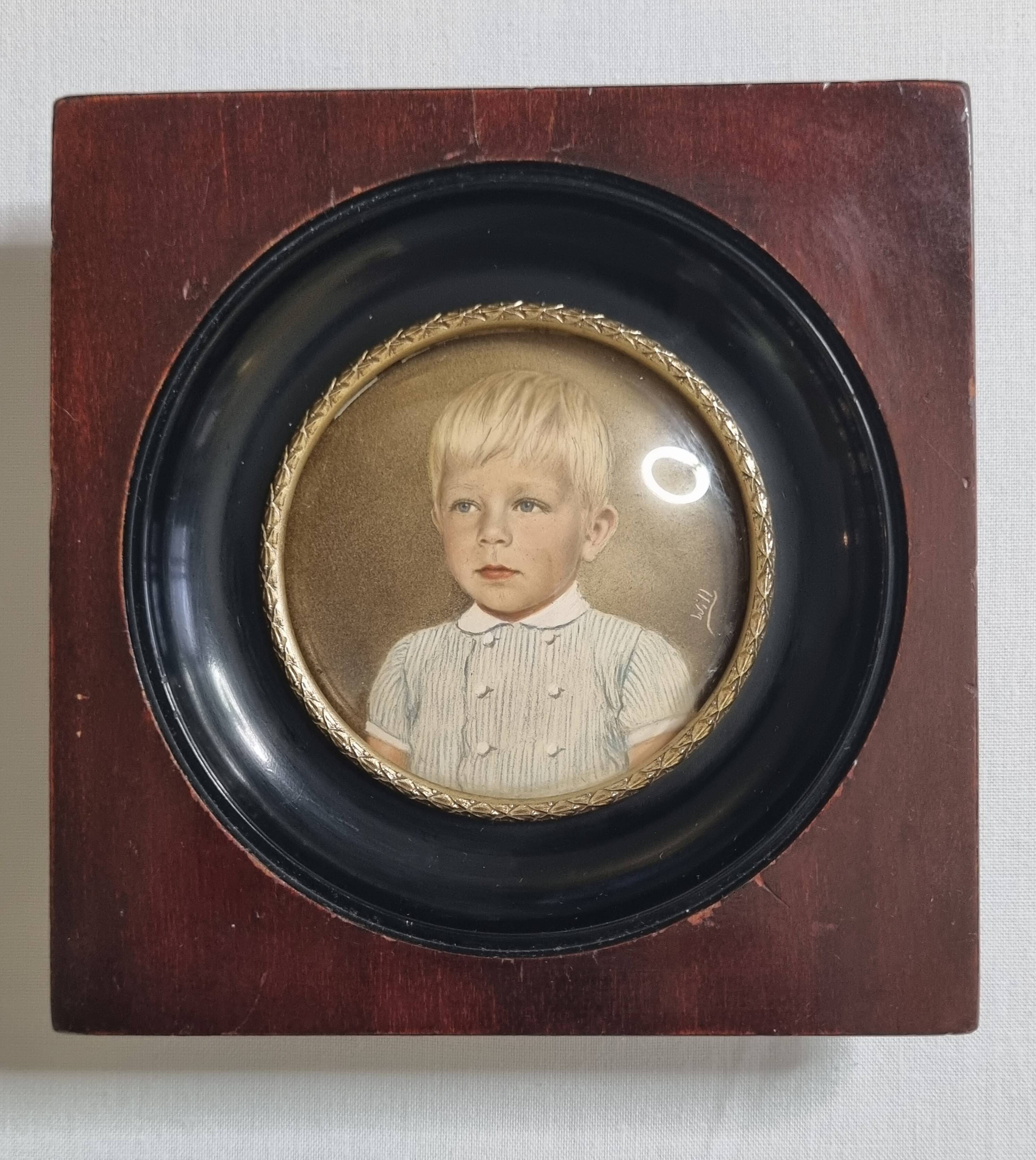 Miniature portrait of a young boy signed, wooden frame with convex glass, 12x12 cm.