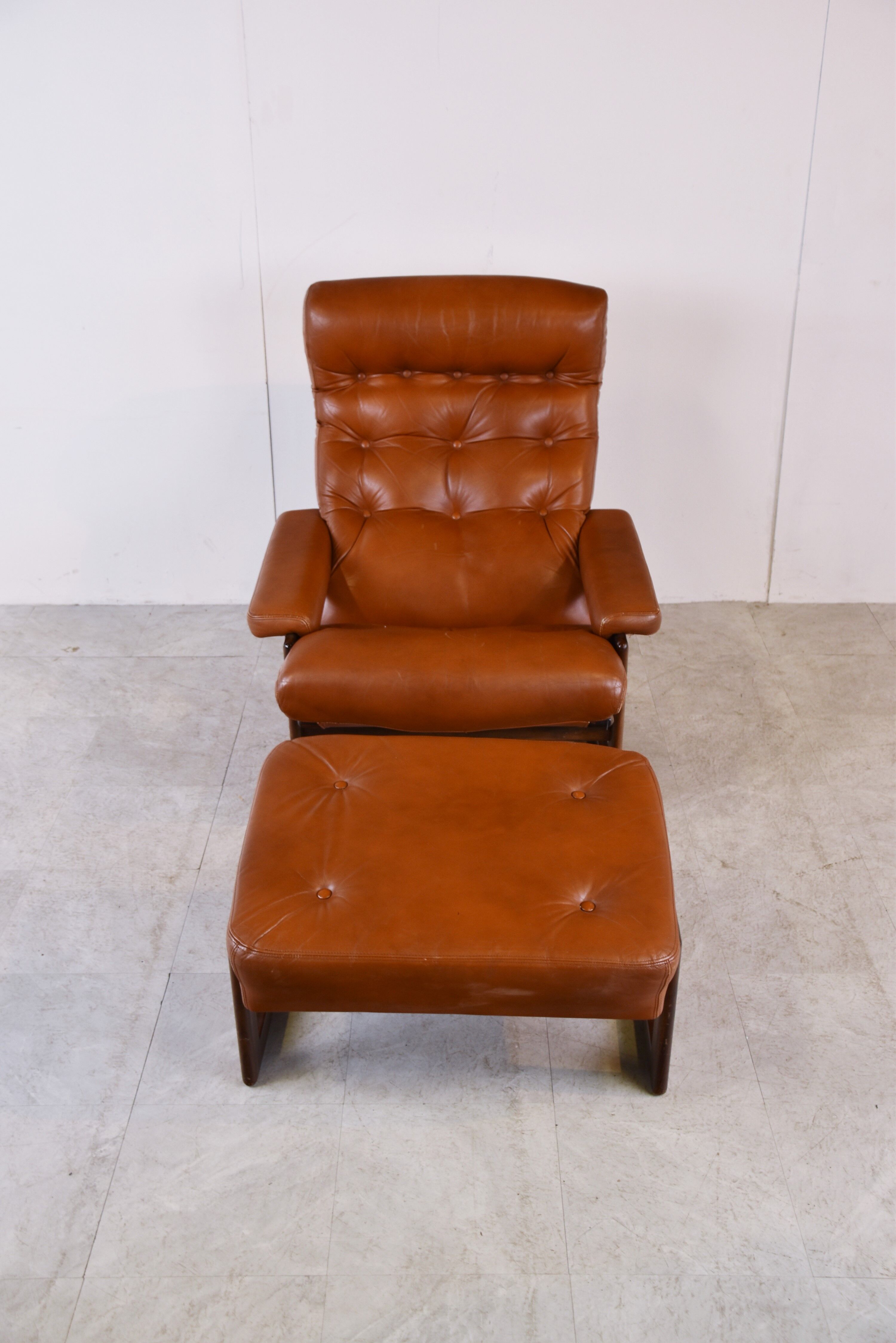 Vintage leather armchair with hocker, 1970s