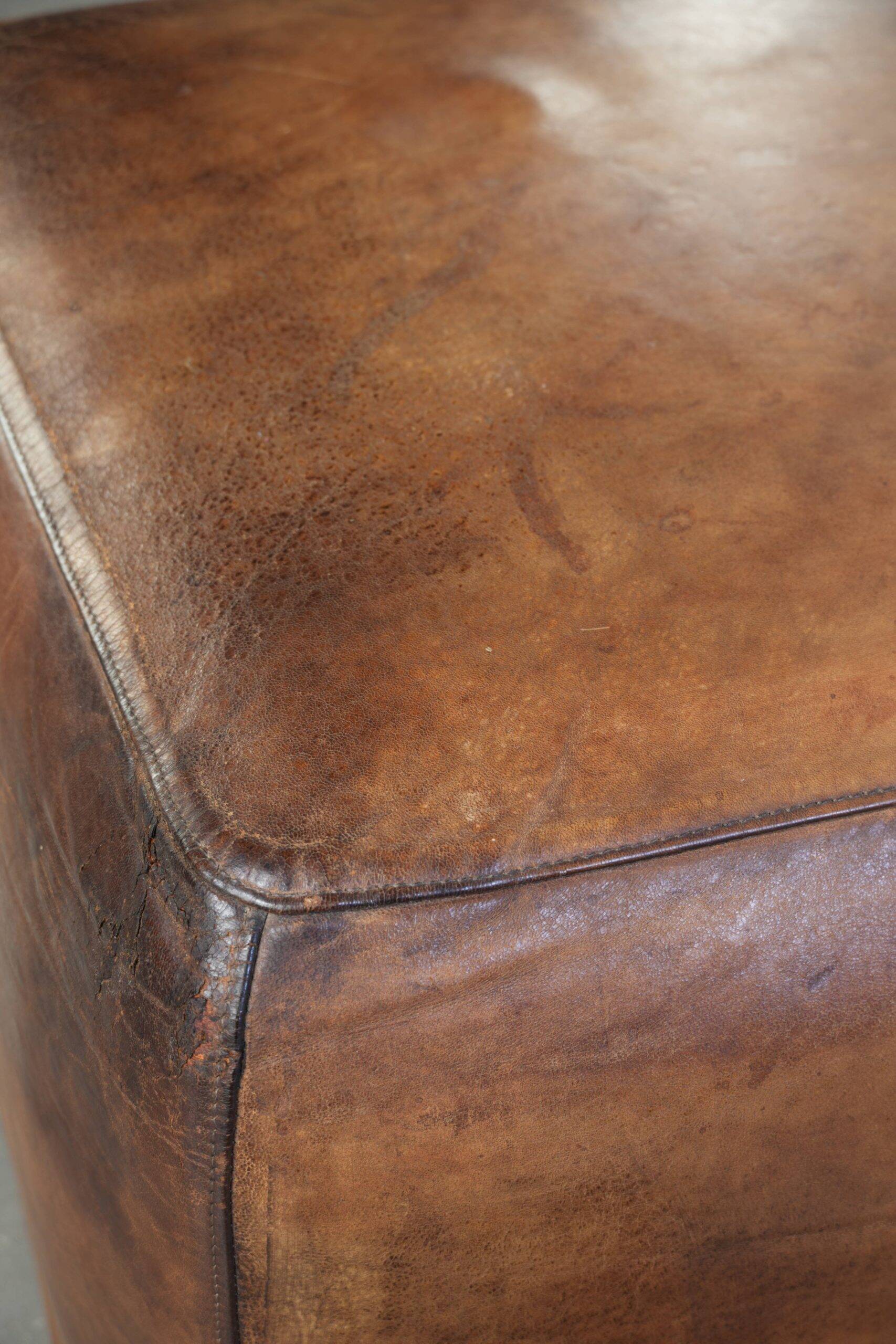 Sheepskin design ottoman with a very beautiful patina and stunning colours