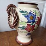 Ceramic vase with hand-painted floral decoration.