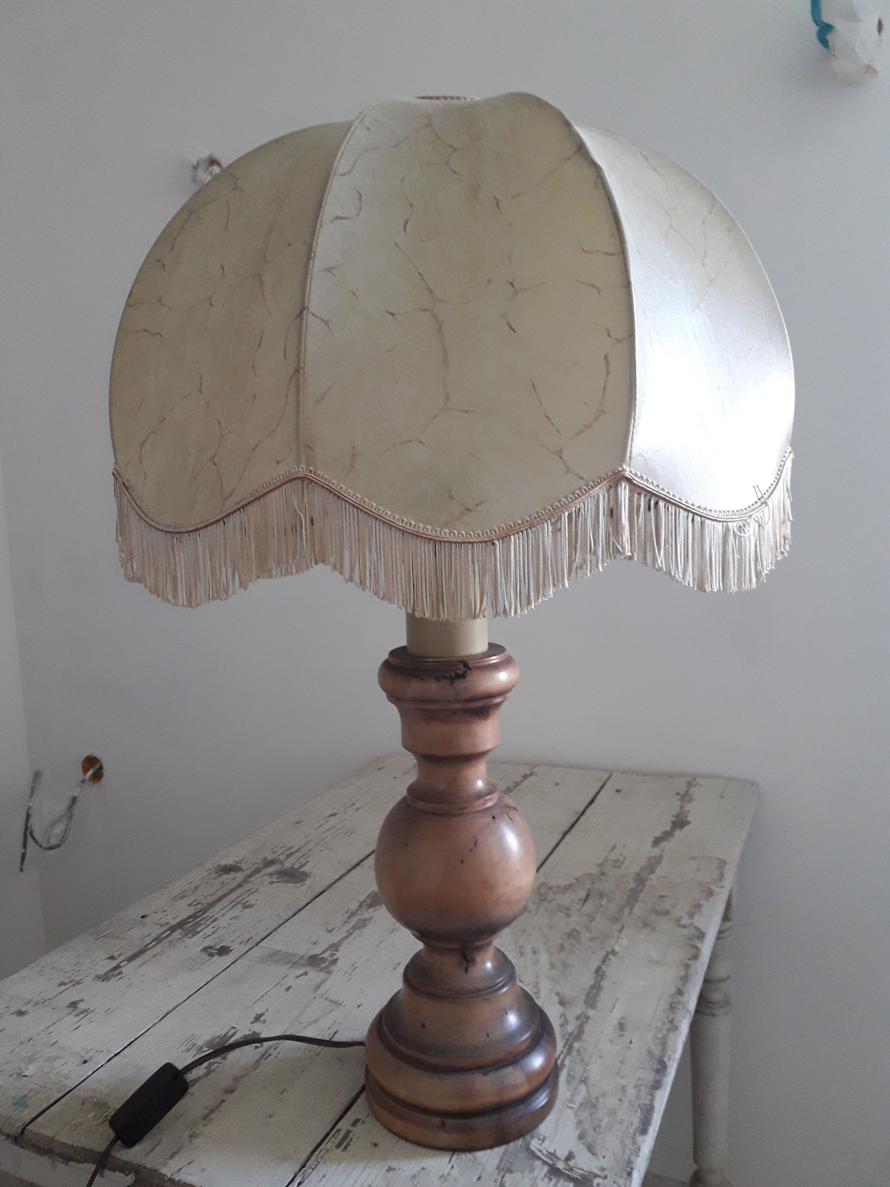 Turned wood table lamp with “skin” shade