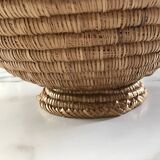 Large bowl on a woven wicker stand