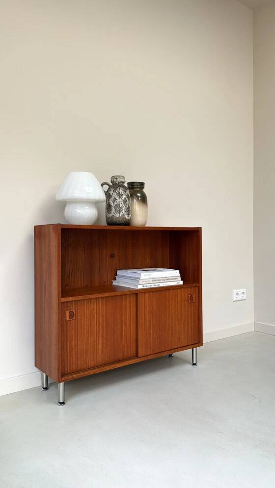 Vintage wooden cabinet with sliding doors
