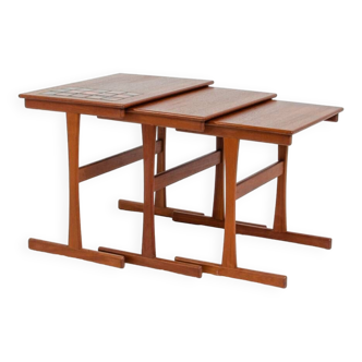 Set of nesting tables with enameled tiles (Denmark, 1950s).