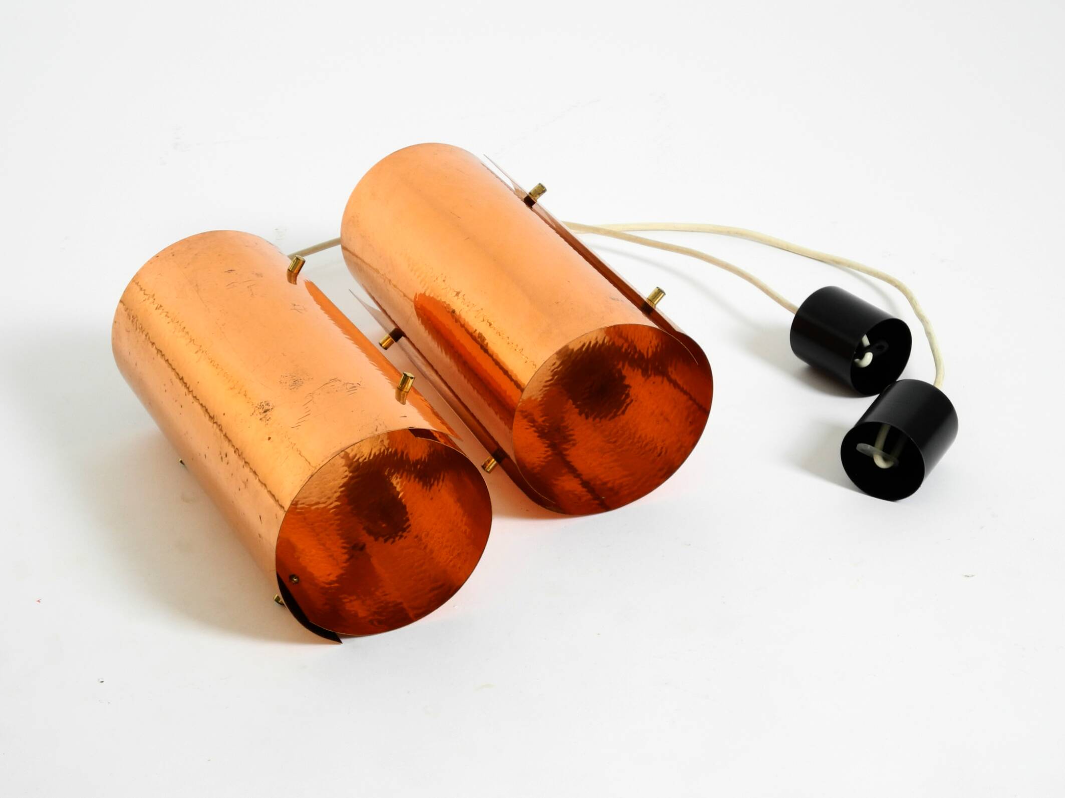 Two 50s tube pendant lamps consisting of two screwed-together copper bowls