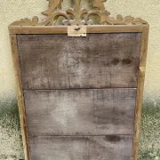 Antique mirror in wood and gilded stucco with a pediment - in the style of the 18th century.