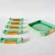 set of coasters and knife holders in mint green and gold art deco ceramic 1930