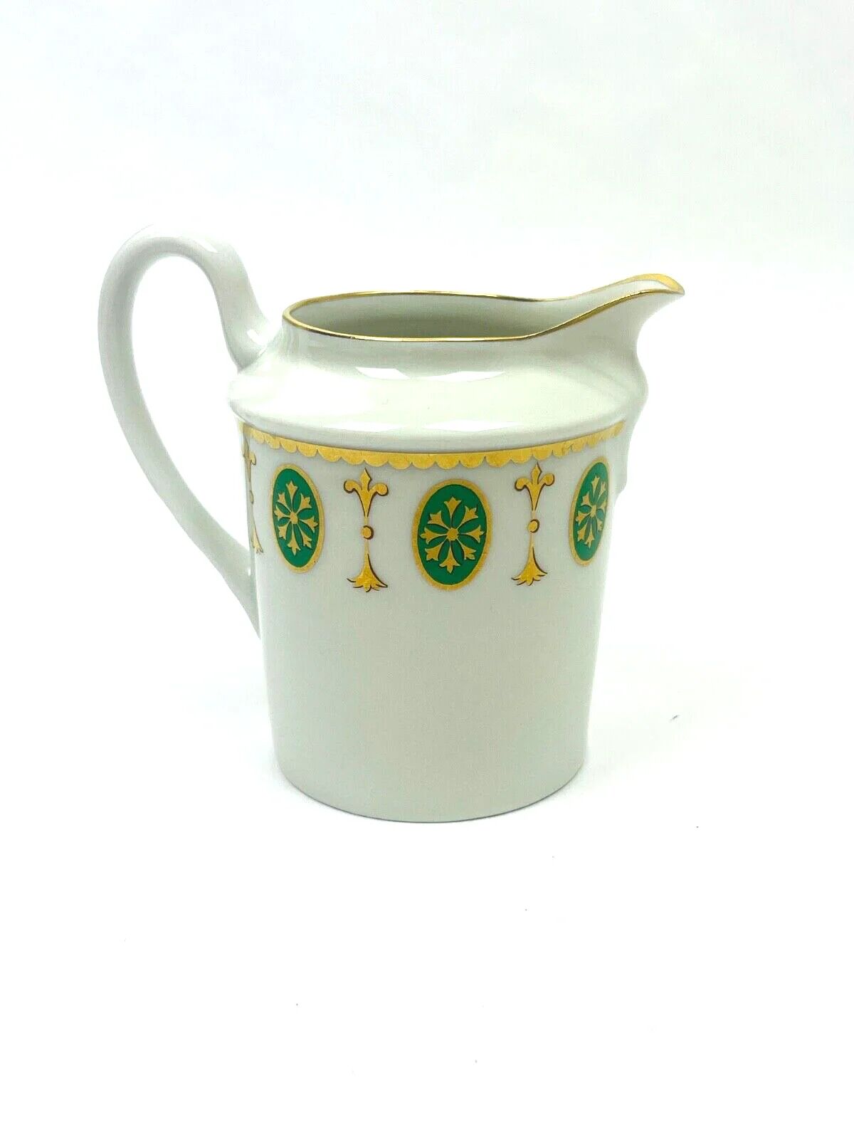 Set of 6 tea cups and 1 cream jug in Paris porcelain, Louis XVI decoration.