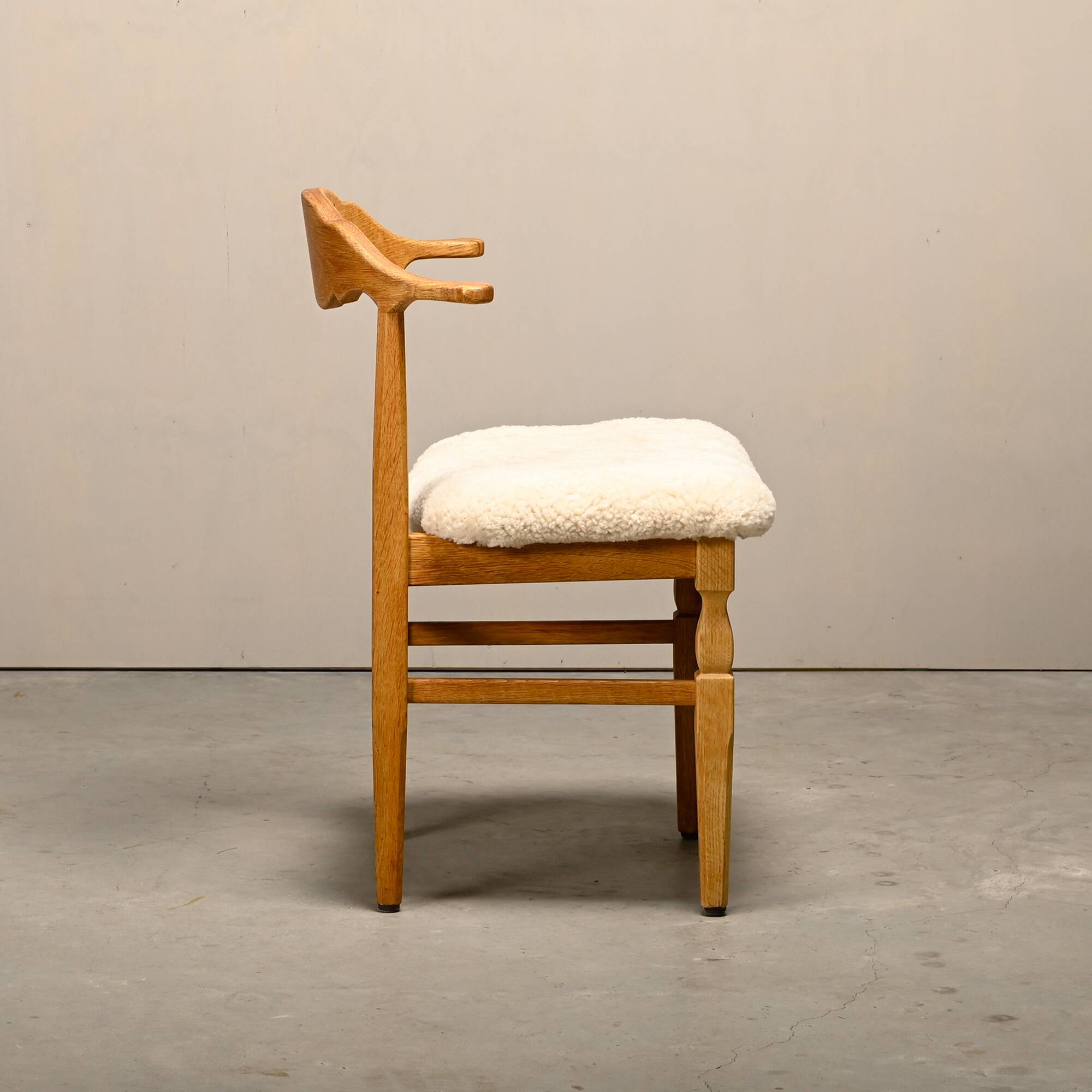 Henning Kjærnulf dining chairs set in Oak and Sheepskin, Denmark, 1960s