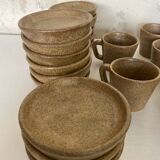 Set of stoneware coffee cups with saucers