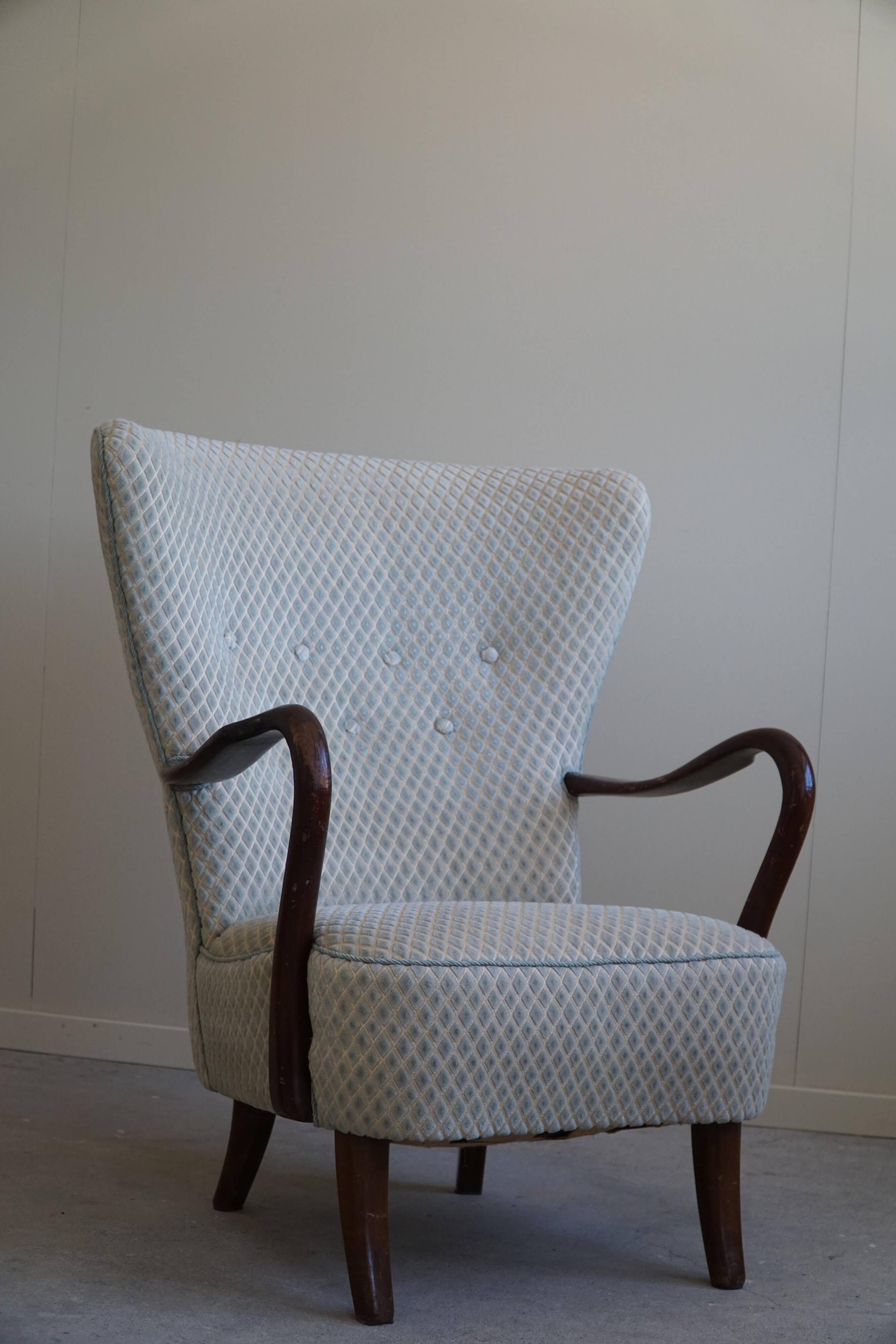 Slagelse Møbelfabrik, modern Danish lounge armchairs with beech footrests, 1960s.