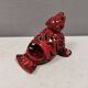 Beautiful seal in ceramic with metallic red glaze.