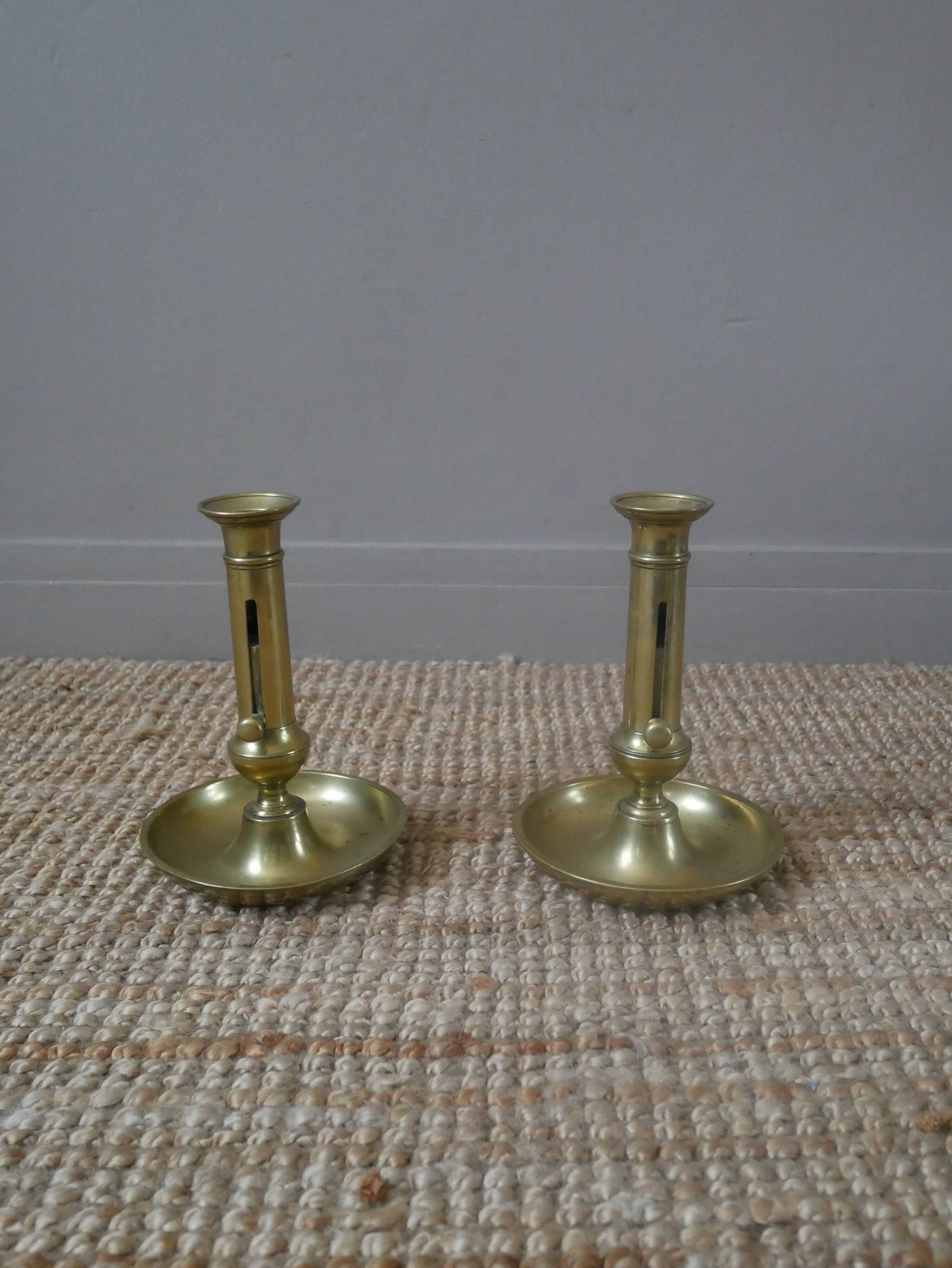 Pair of brass push-button candlestick holders in gold metal, bohemian country decoration