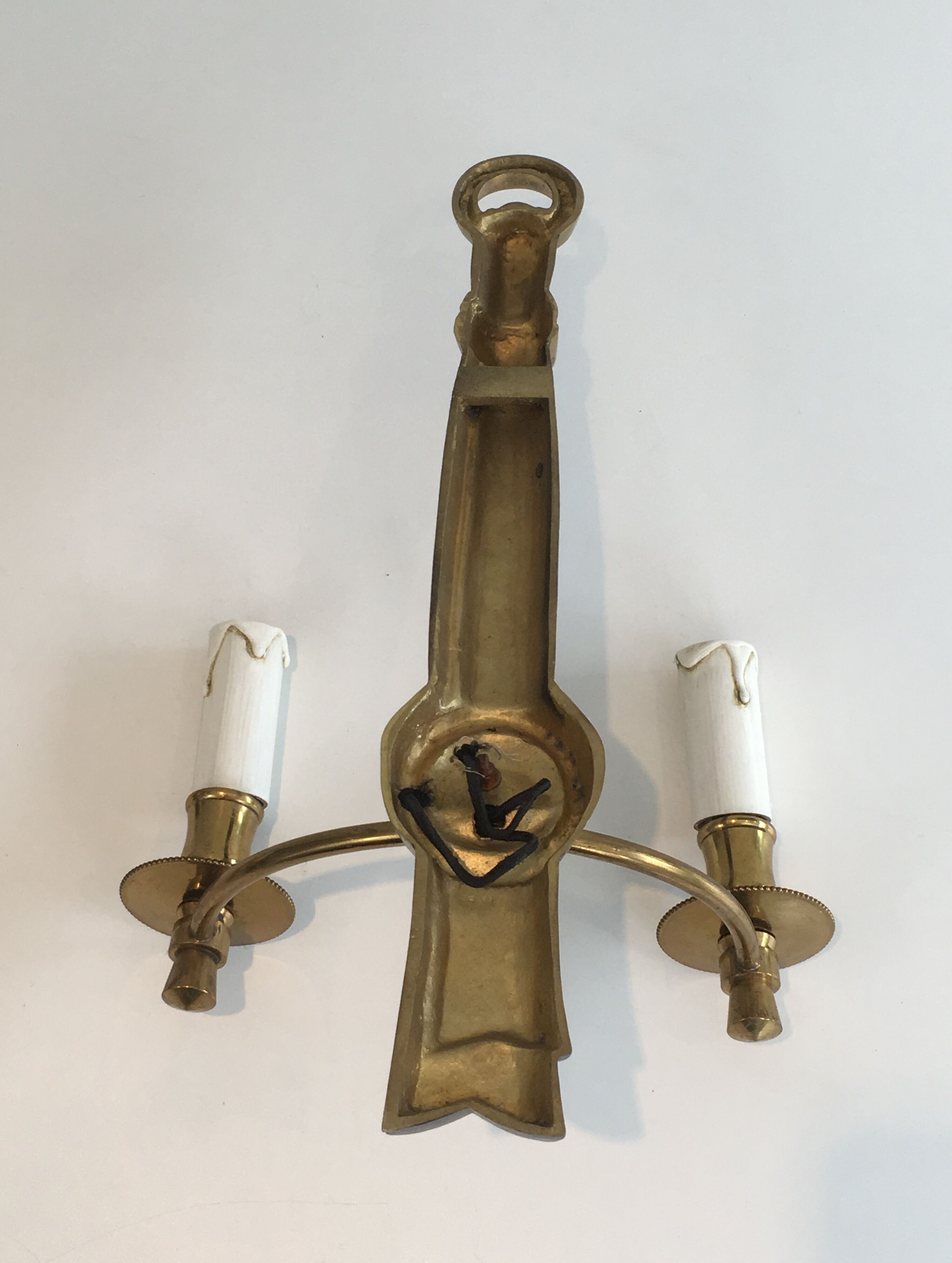 Pair of Black Lacquered Bronze Wall Lamps with Lions' Head Decorations. Around 1970