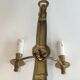 Pair of Black Lacquered Bronze Wall Lamps with Lions' Head Decorations. Around 1970