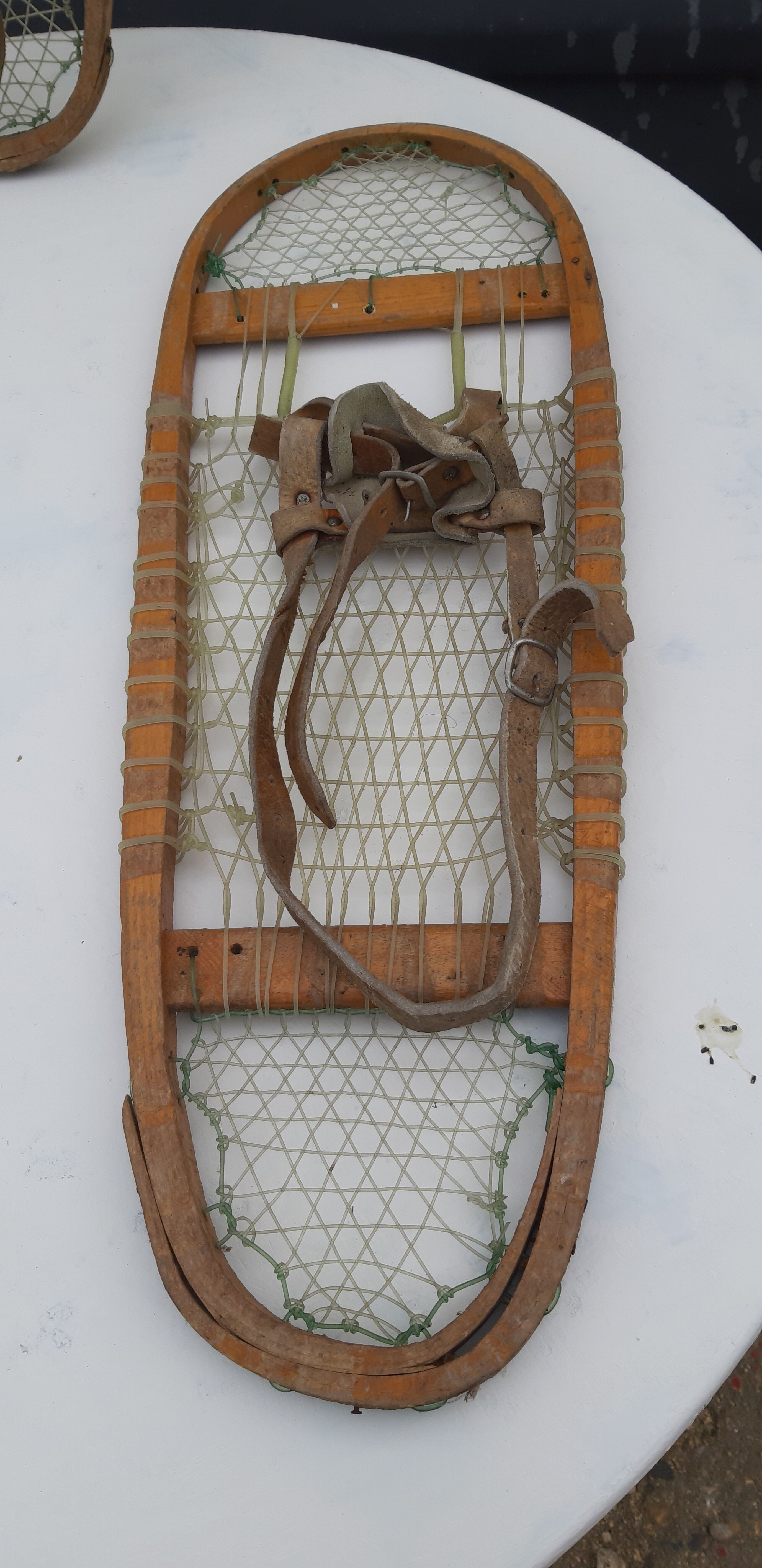 Old snowshoes made of wood and hoses