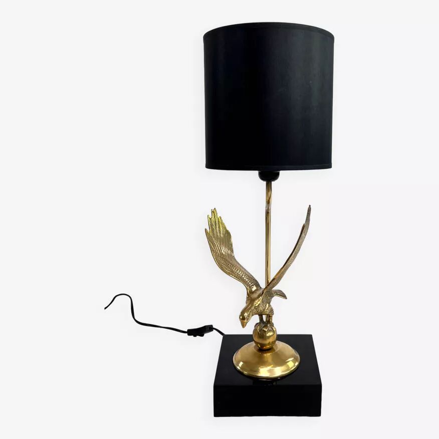 Brass lamp on black lacquered wooden base