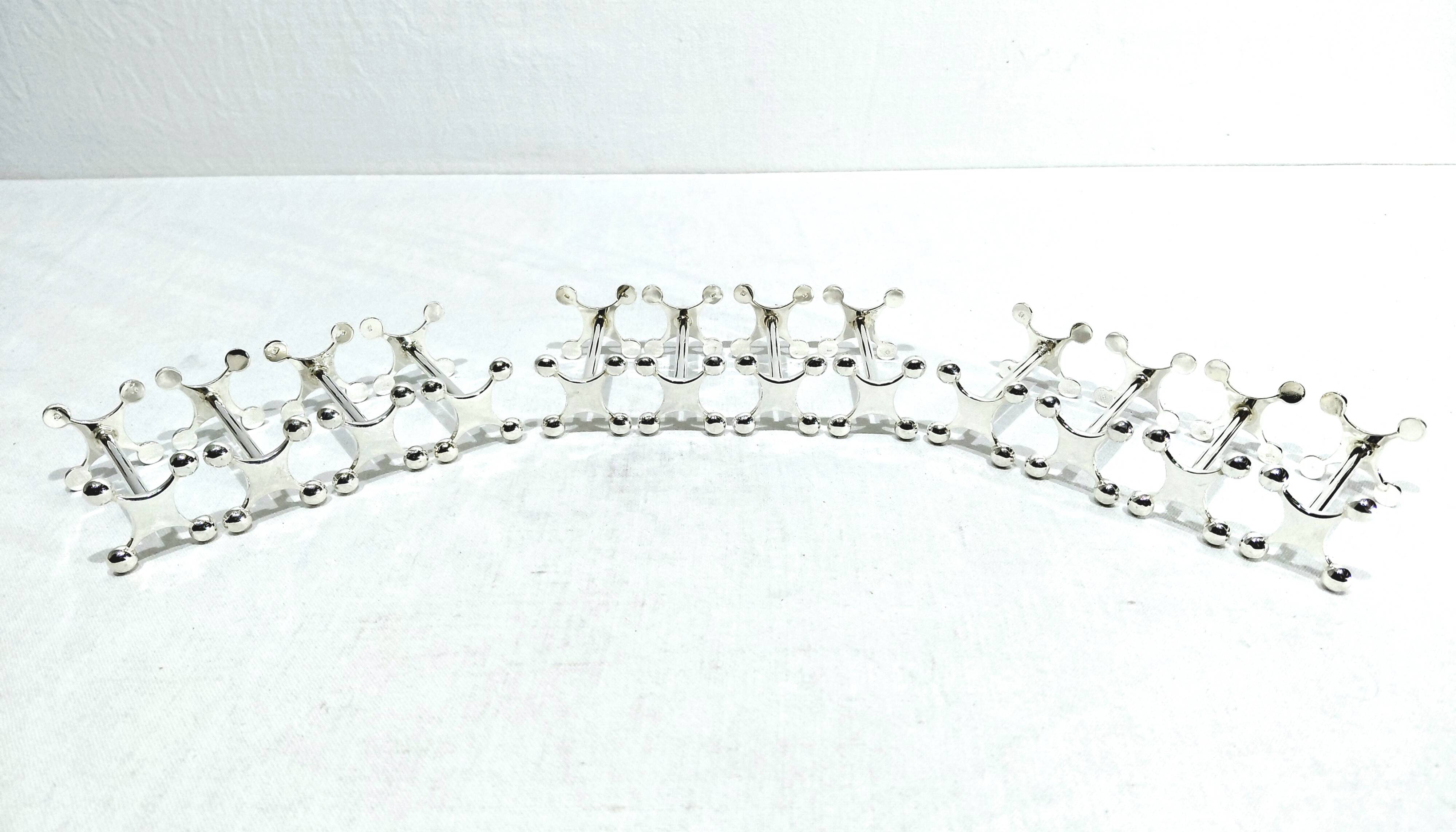 SET OF 12 SILVER-PLATED KNIFE RESTS