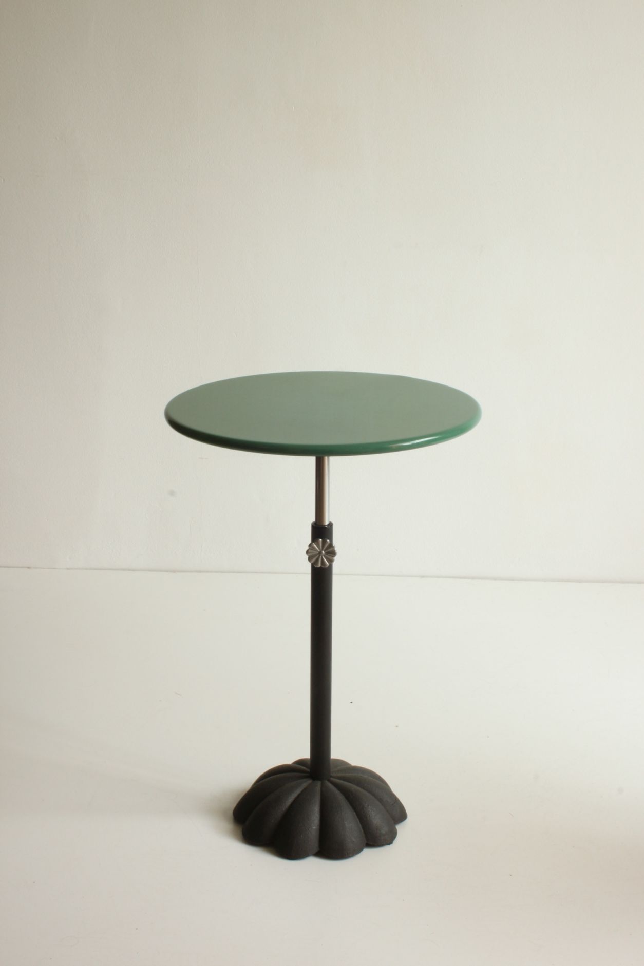 Postmodern cast iron flower base adjustable round side tables, blue and green, 1980s.