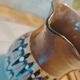 Pitcher with ethnic decorations