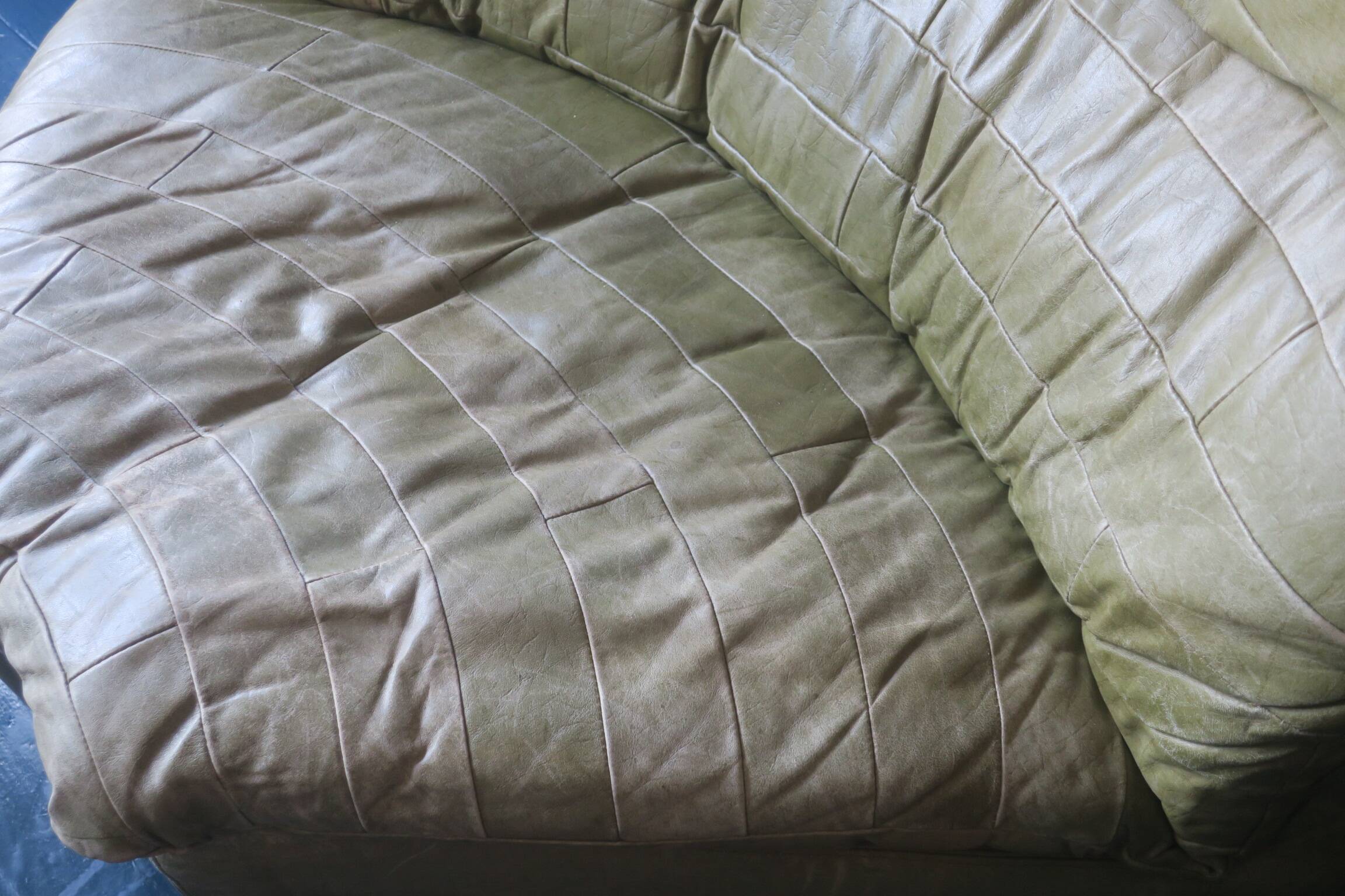 Patchwork large olive green leather corner lounge chair by Laauser, 1970s