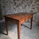 Old French table in cherry wood with bistro chair, circa 1900–1930.