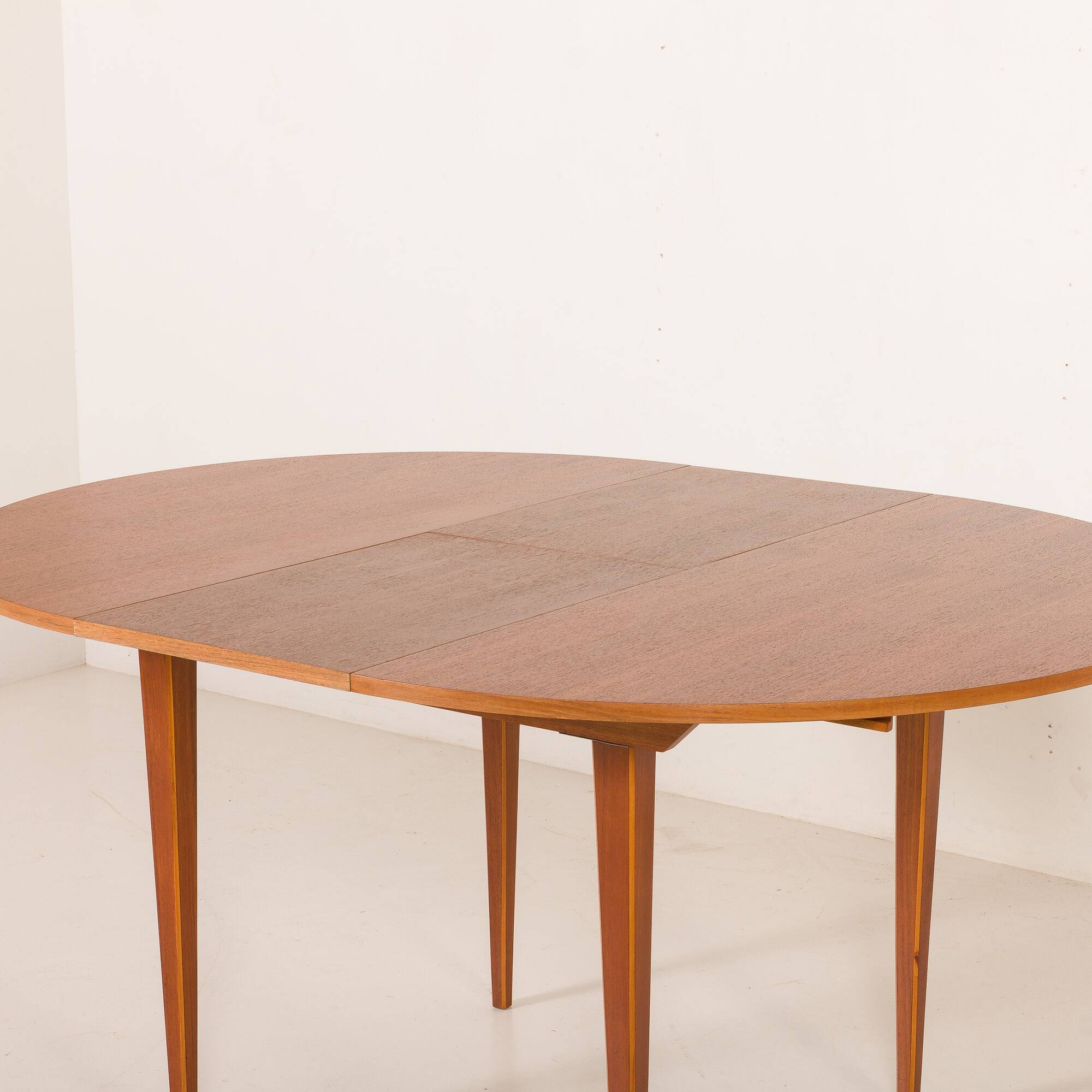 Scandinavian round teak table with hidden extension, 1970s