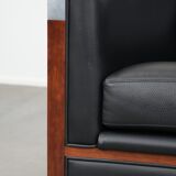 Art Deco design armchair with black leather with decorative stitching