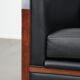 Art Deco design armchair with black leather with decorative stitching