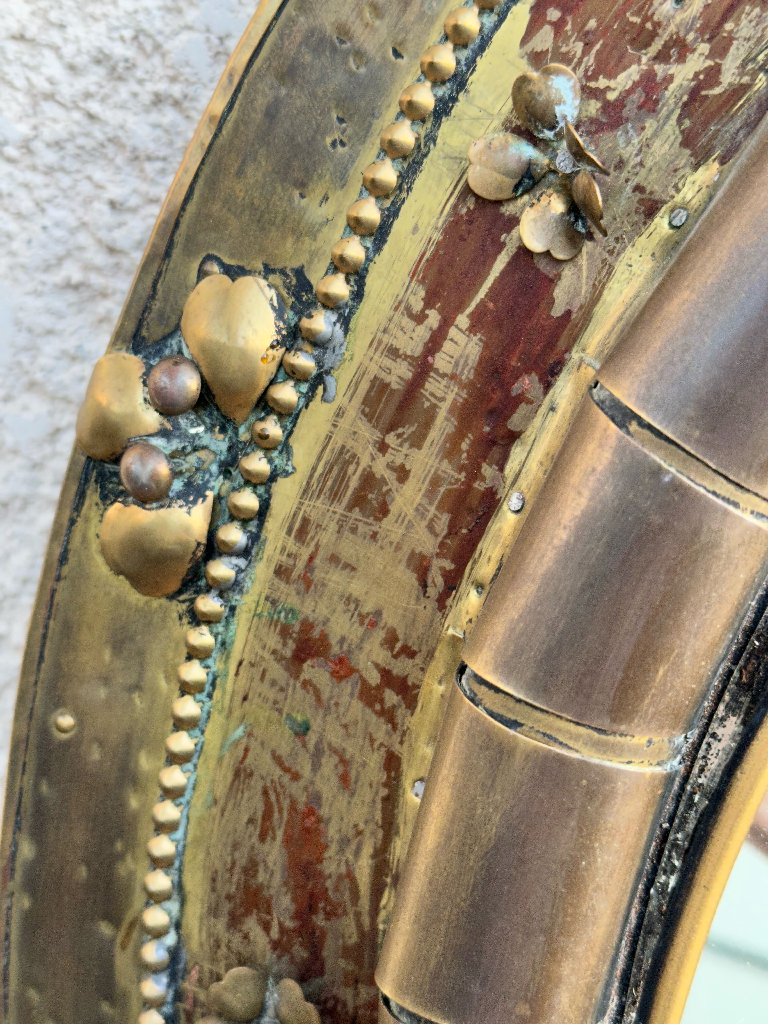 Round mirror in worked copper, Italy 1950