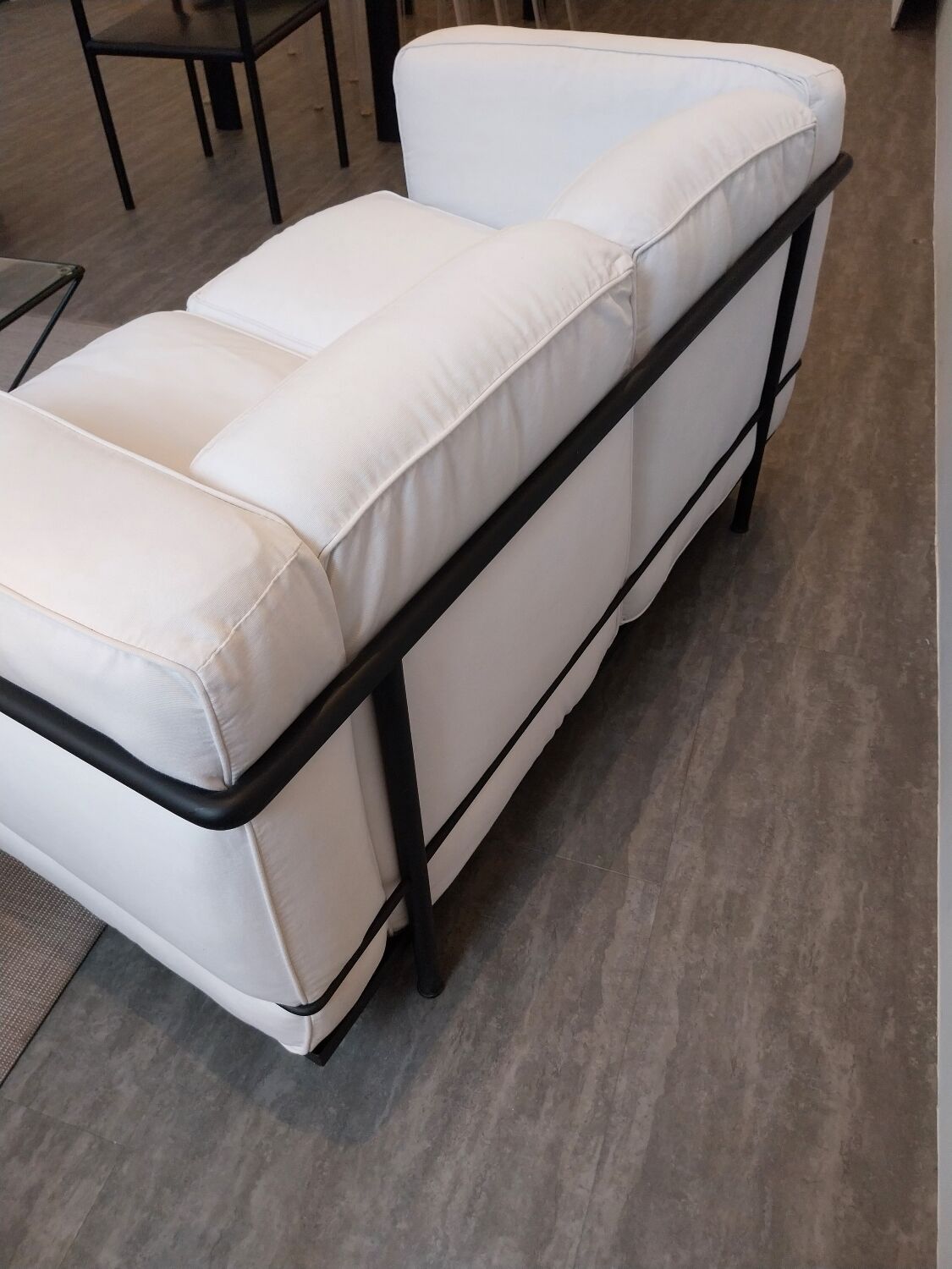 A sofa and two LC2 Cassina armchairs