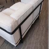 A sofa and two LC2 Cassina armchairs