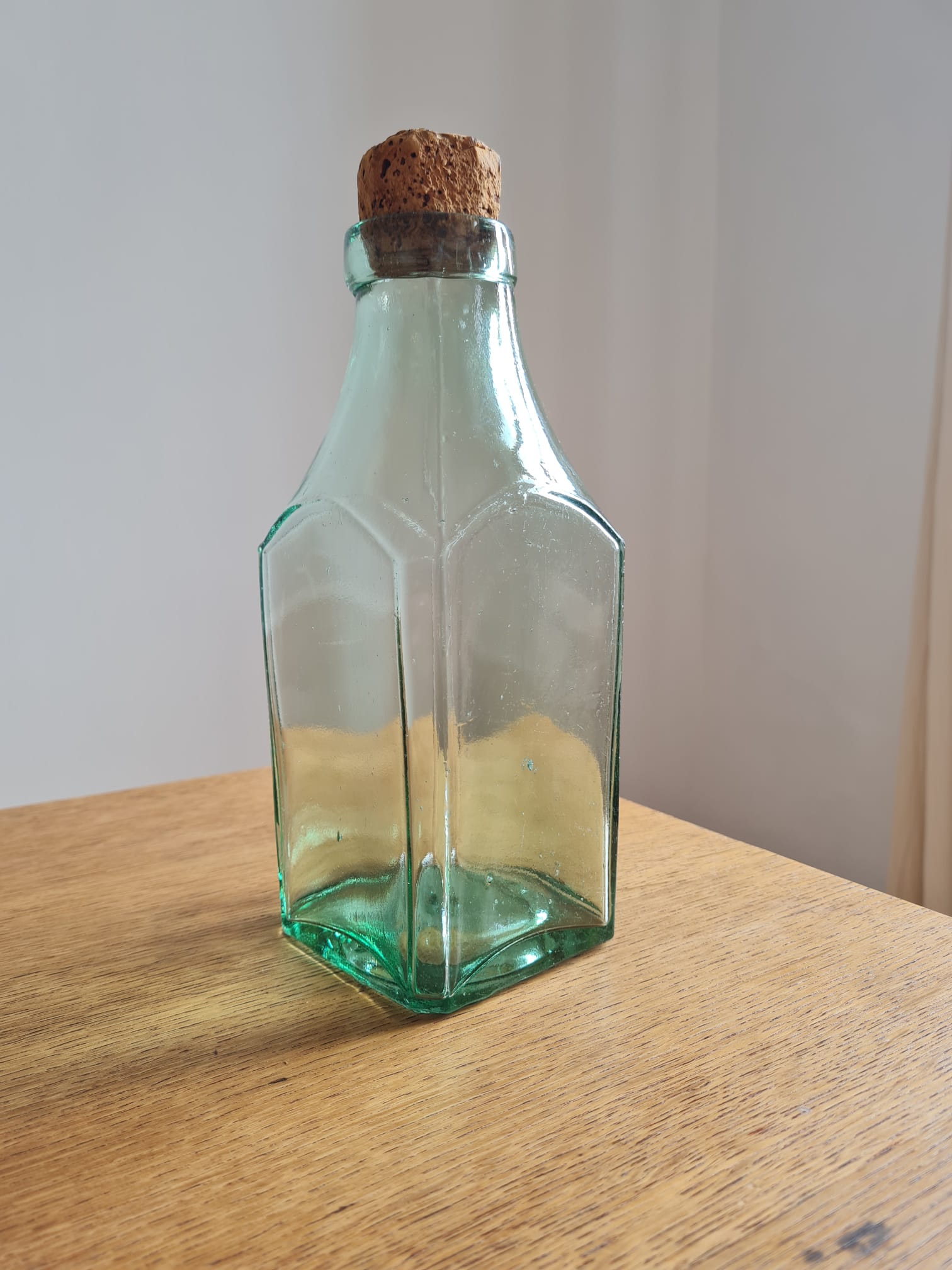 Green blown glass bottle