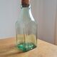 Green blown glass bottle