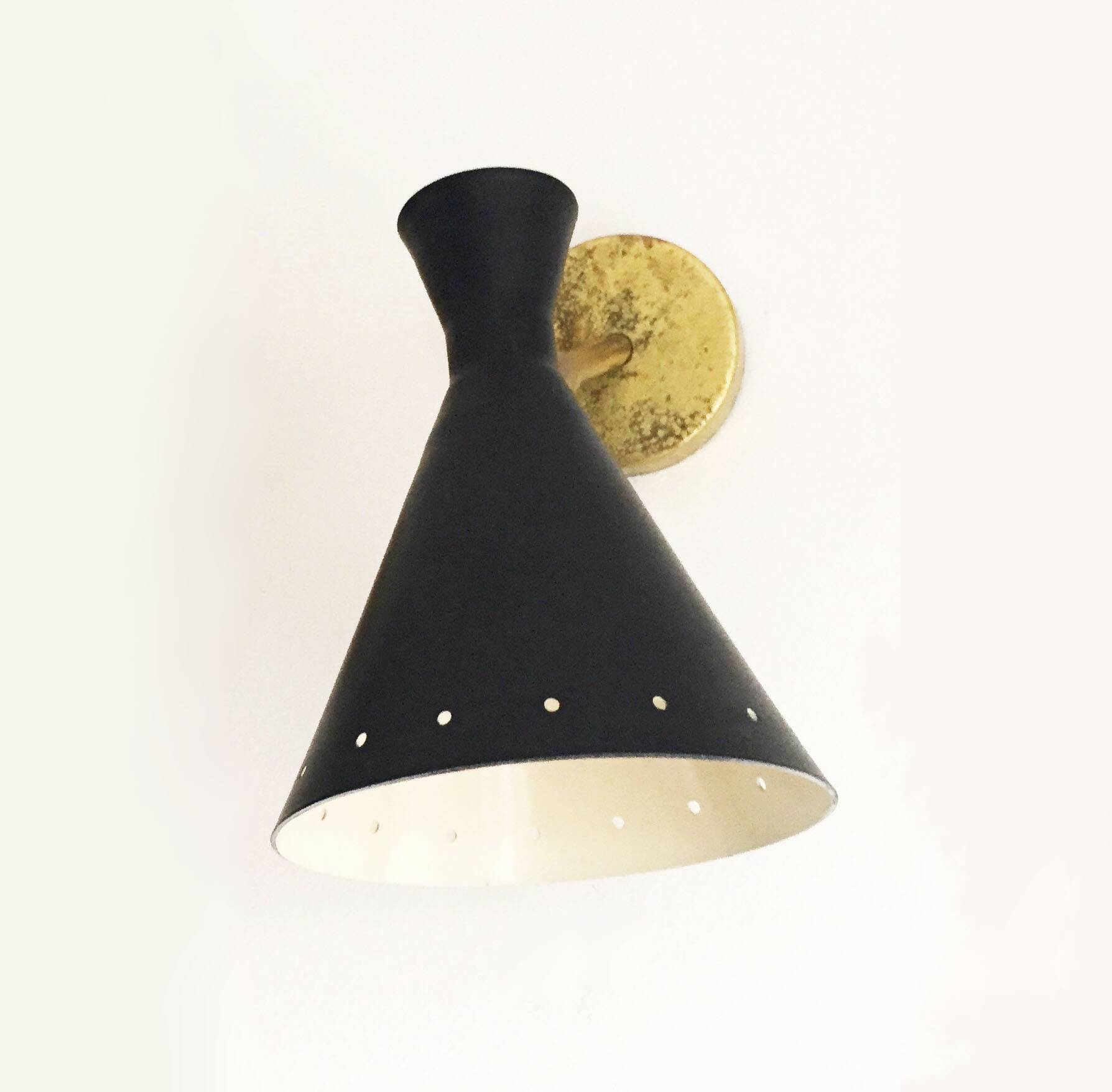 Set of three Italian wall lights in brass and lacquered iron, 1950s design.