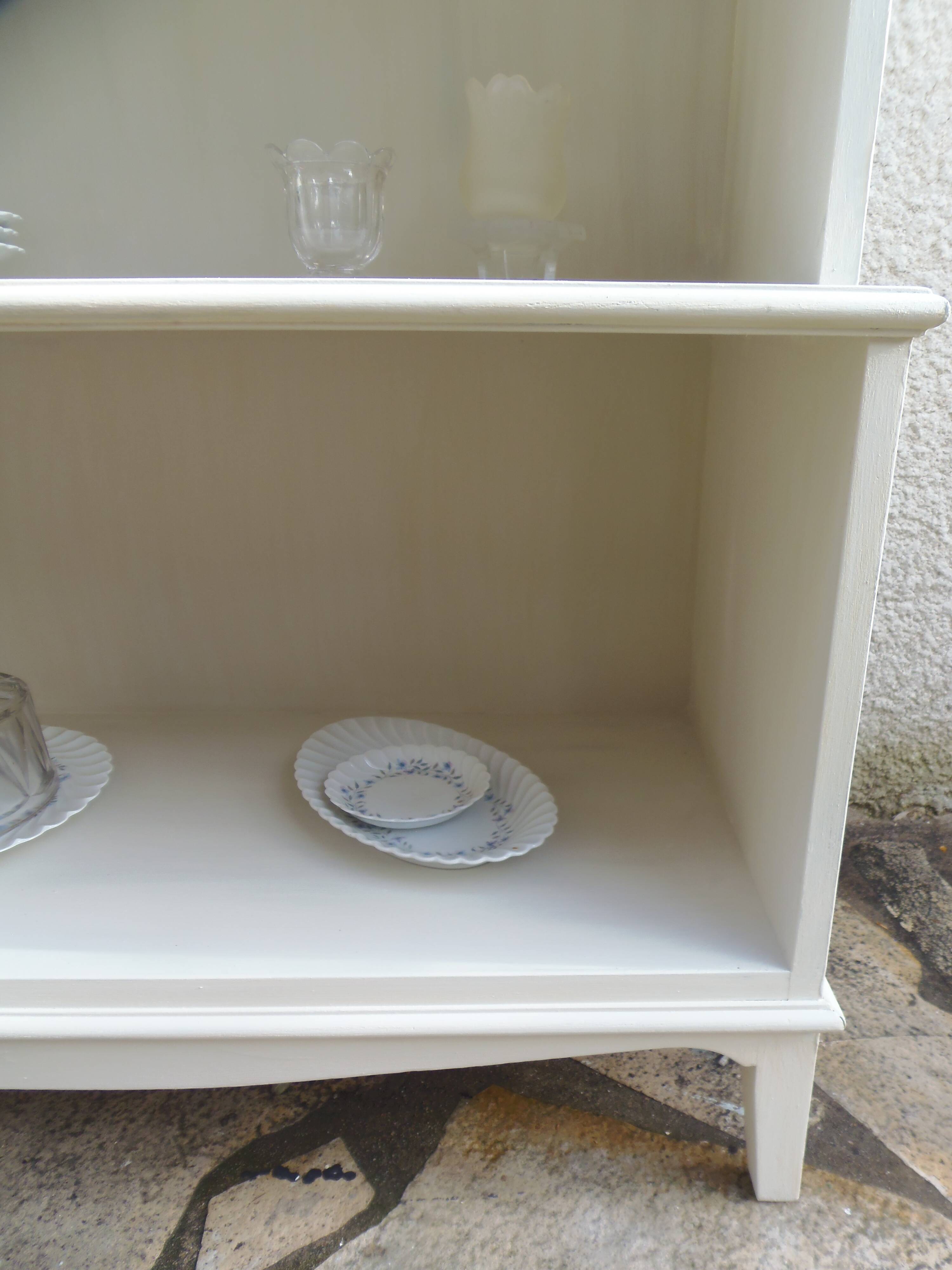 Vintage library enhanced in beige, wooden top.