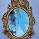 Large oval gold mirror, Louis XV rococo style, late 19th century, 114 x 66 cm.