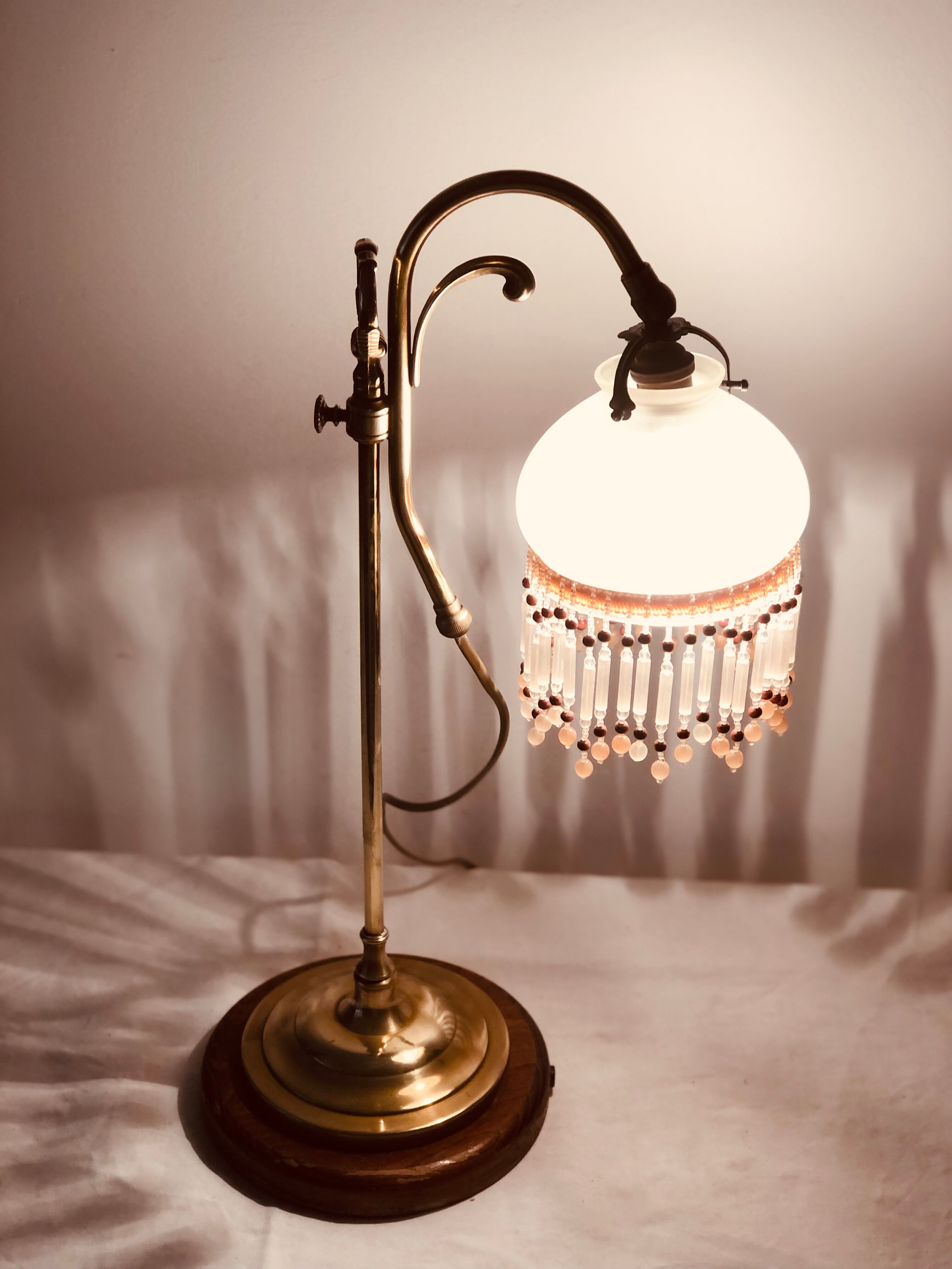 Old lamp adjustable on foot tulip golden brass.